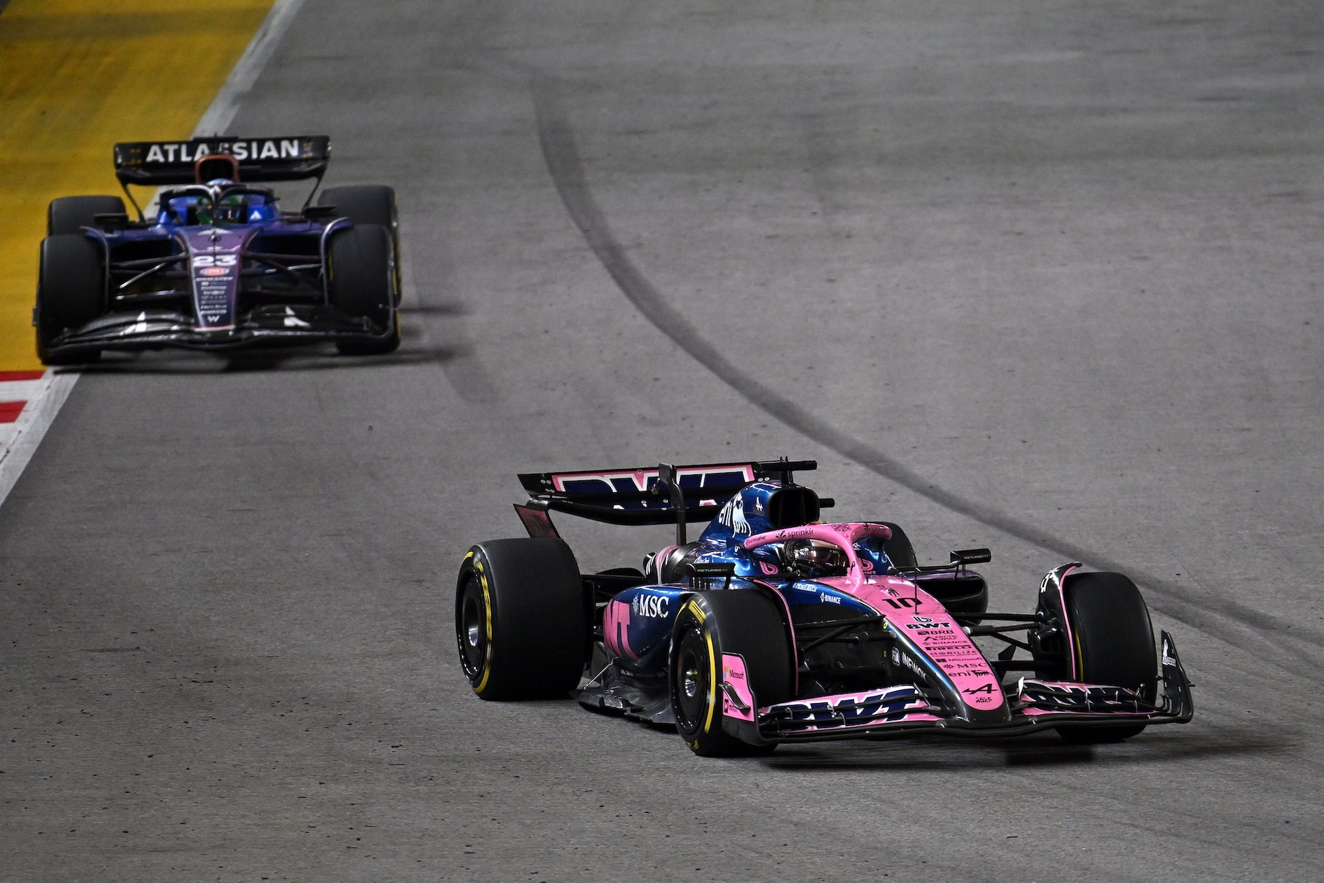Singapore, Singapore - October 05: Pierre Gasly Of France Driving The (10) Alpine F1 A525 Renault Leads Alexander Albon Of Thailand Driving The (23) Williams Fw47 Mercedes On Track During The F1 Grand Prix Of Singapore At Marina Bay Street Circuit On October 05, 2025 In Singapore, Singapore. (Photo By Sam Bagnall/Sutton Images)