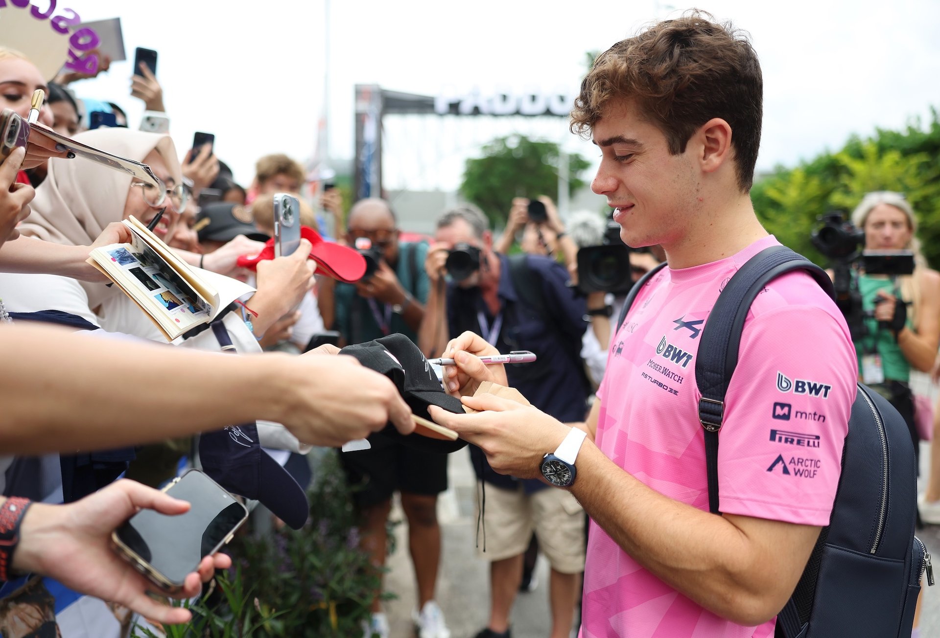 Singapore, Singapore - October 03: Franco Colapinto Of Argentina And Alpine F1 Signs Autographs For Fans As He Arrives In The Paddock Prior To Practice Ahead Of The F1 Grand Prix Of Singapore At Marina Bay Street Circuit On October 03, 2025 In Singapore, Singapore. (Photo By Glenn Dunbar/Lat Images)